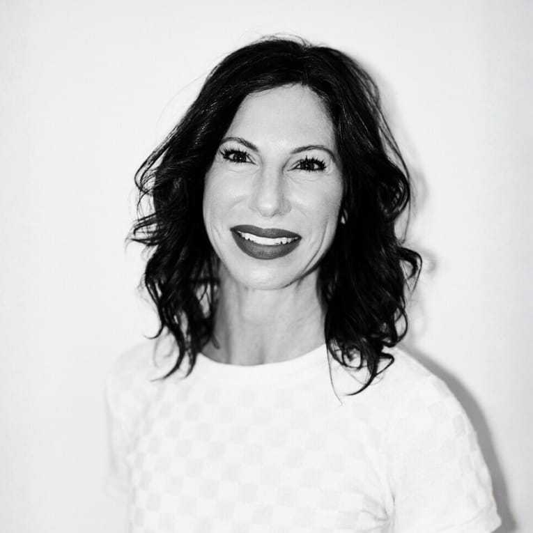 Portrait of Sharle, a professional stylist at Matthew Morris Salon, showcasing their expertise and style.