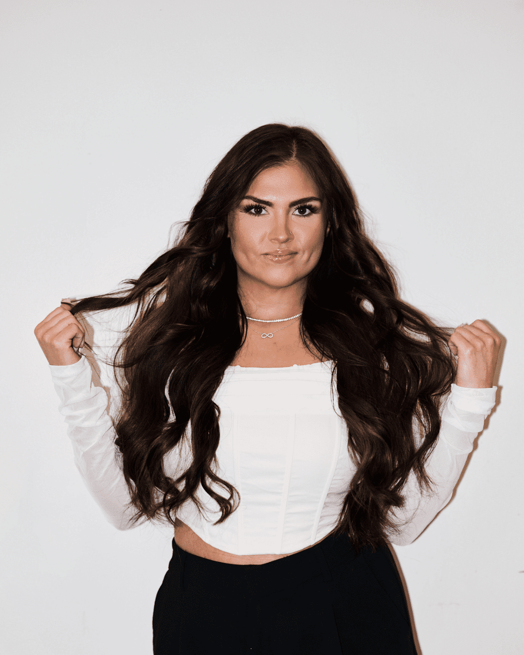 Portrait of Taylor Maes, a professional stylist at Matthew Morris Salon, showcasing their expertise and style.